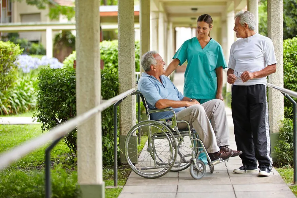 Compassionate caregiver supporting a senior client at home